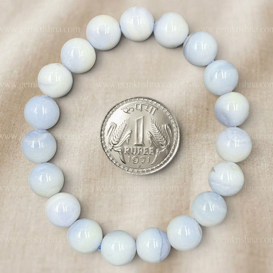 Blue Lace Agate Bracelet with round beads arranged in a circle around a 1971 Indian rupee coin
