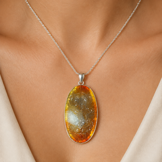 925 silver carnelian pendant necklace worn on a model with oval orange stone