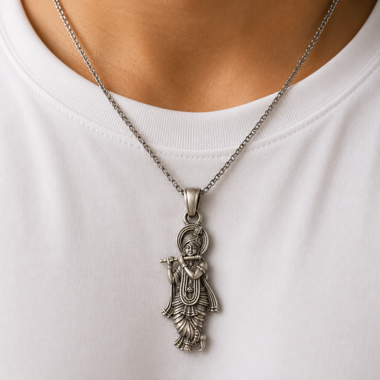 925 silver Lord Krishna murli pendant worn on a silver chain against a white shirt