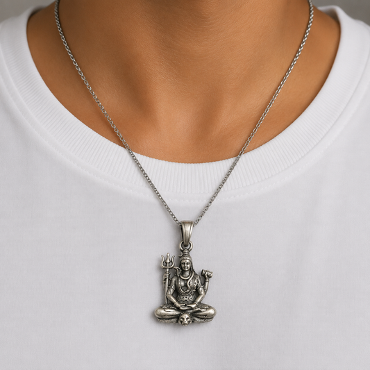 925 silver Lord Shiva trishul damru pendant worn on a chain over a white shirt