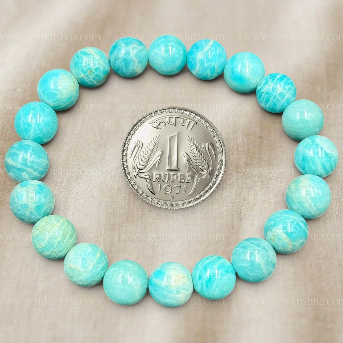 Amazonite Bracelet with round blue-green beads arranged around a 1971 Indian 1 rupee coin