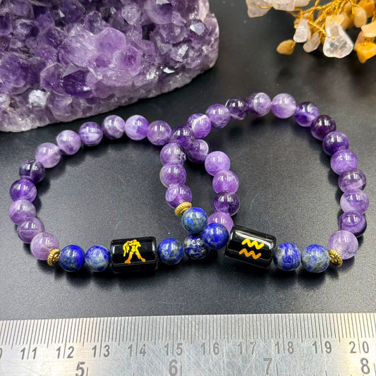 Aquarius zodiac bracelet design with amethyst and lapis lazuli beads with black sign charm