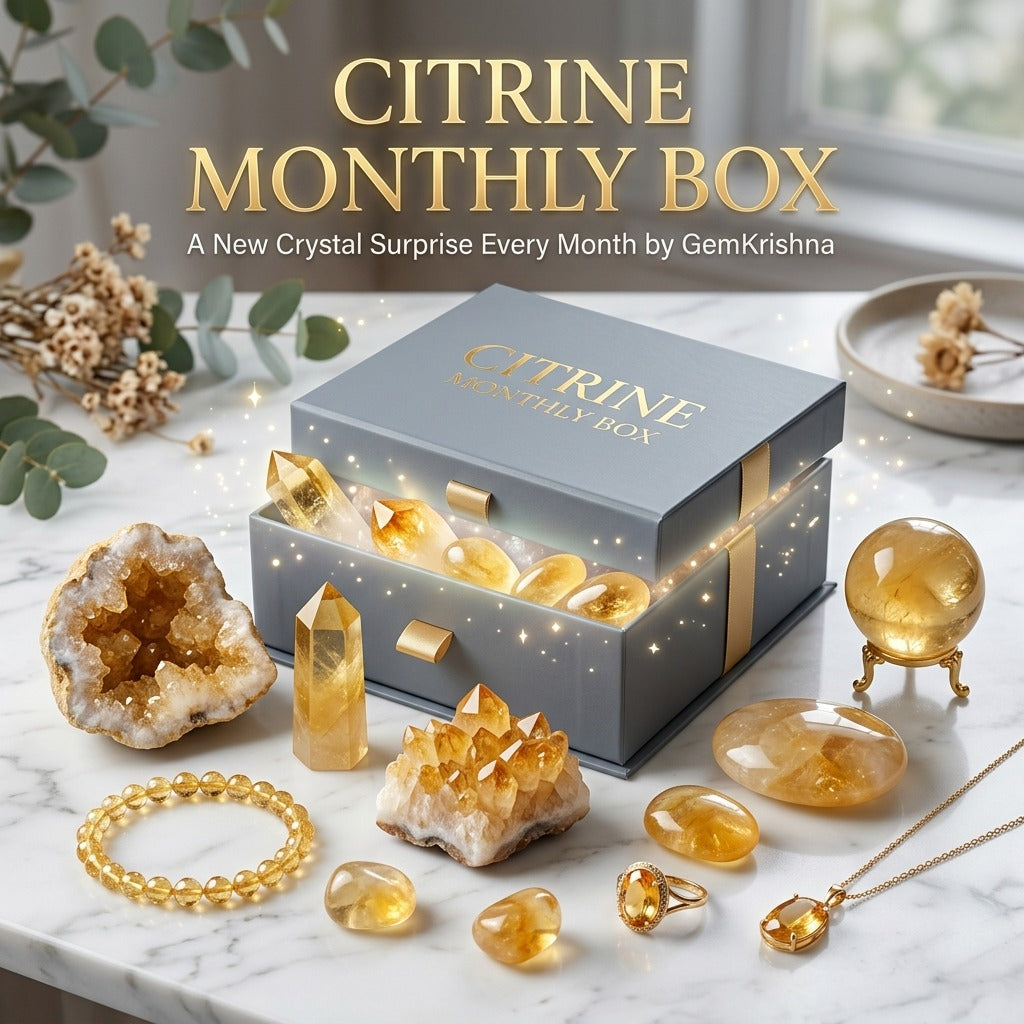 Citrine Monthly Box gift with crystal pieces, jewelry, and blue branded box on marble