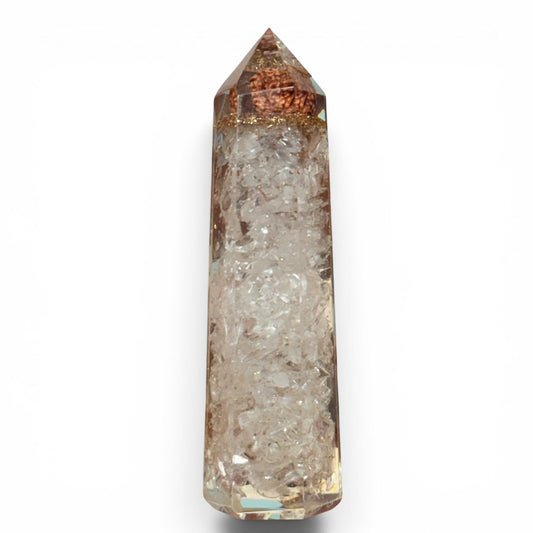 Clear quartz crystal tower with pointed top and faceted sides on a white background