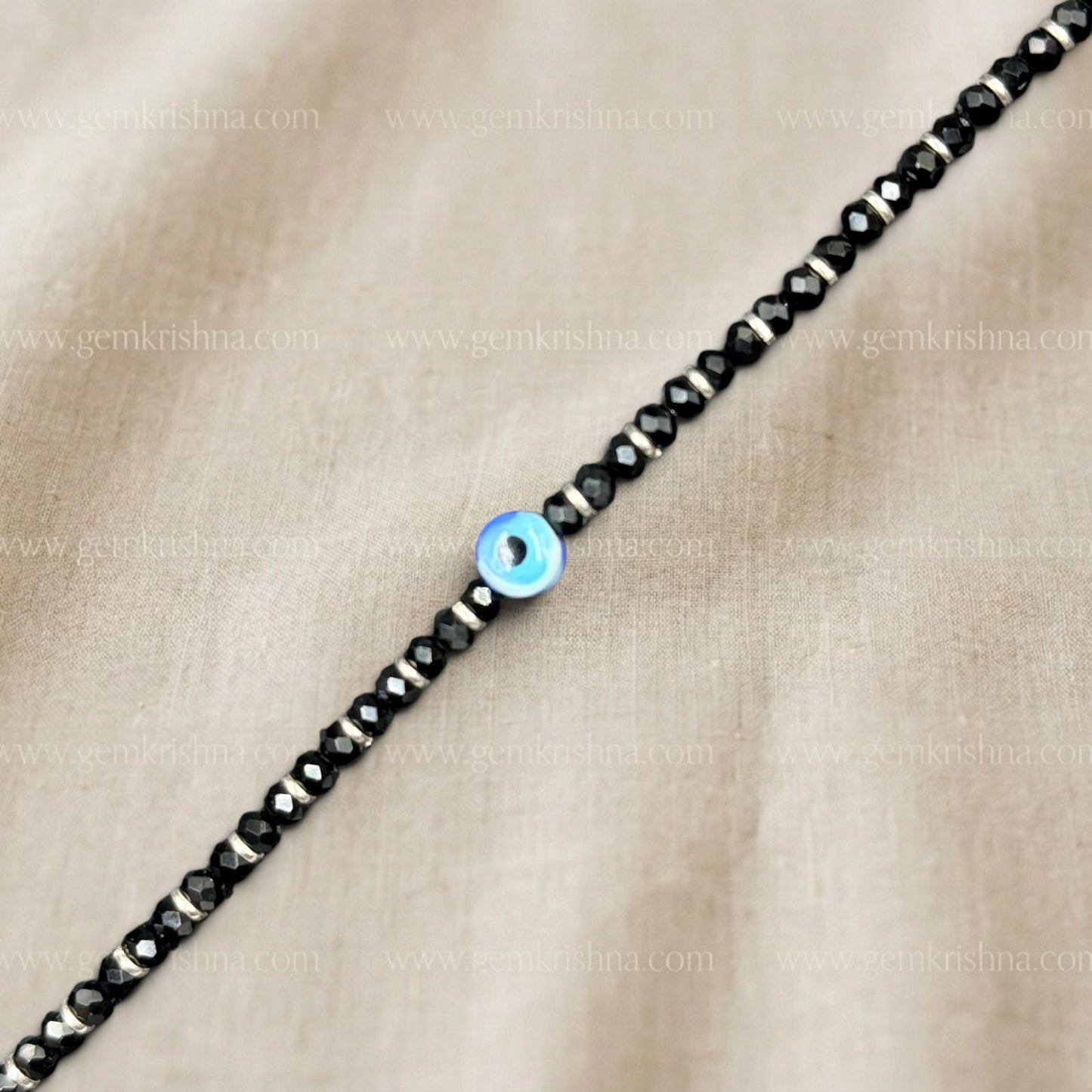 Black onyx 925 silver nazar kavach bracelet close-up of blue evil eye bead and black beads