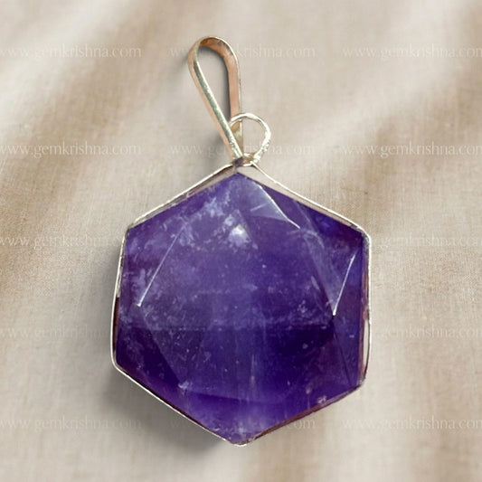 Close-up natural amethyst hexagon locket pendant with gold-tone frame and loop bail