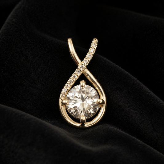 Close-up of CZ solitaire sterling silver teardrop pendant on dark velvet background