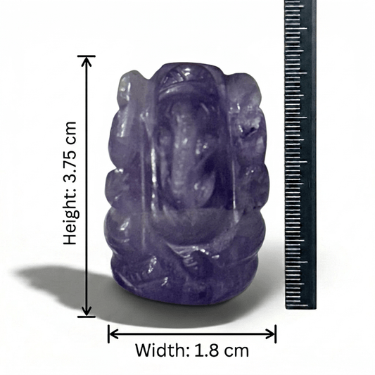 Natural dark amethyst Ganesh carving figure shown with ruler for size