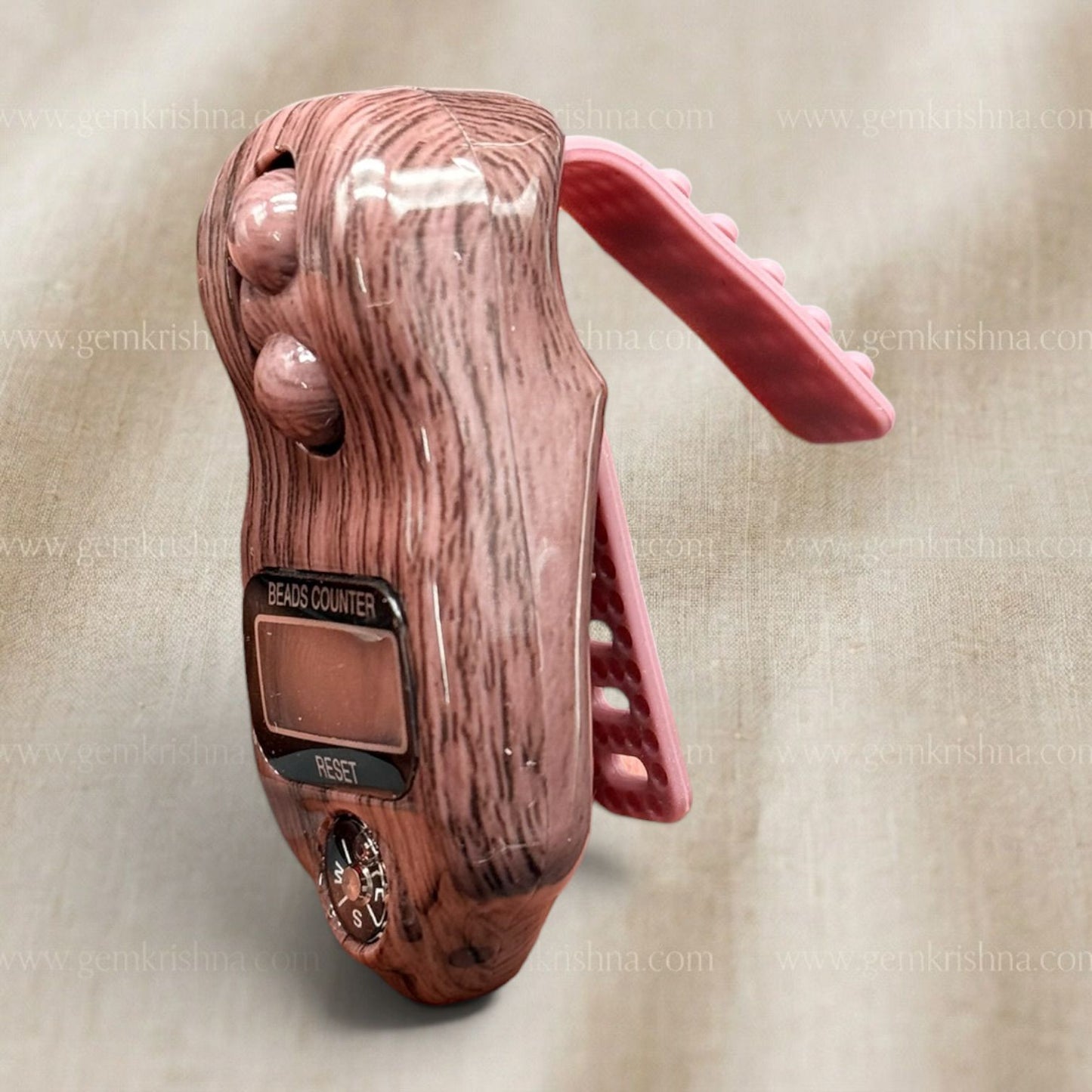 Angle view of digital bead counter with compass, wooden body and display with reset button