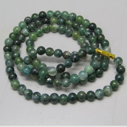 Moss Agate Mala 109 Beads with green and blue round beads and a gold clasp on white background