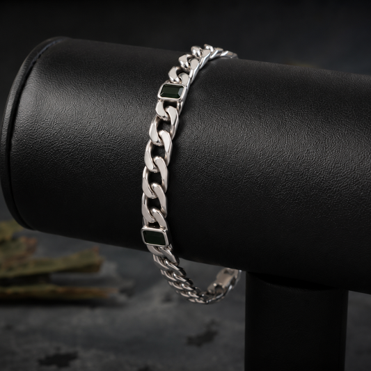 Green stone curb link 925 sterling silver bracelet on a black leather bracelet display