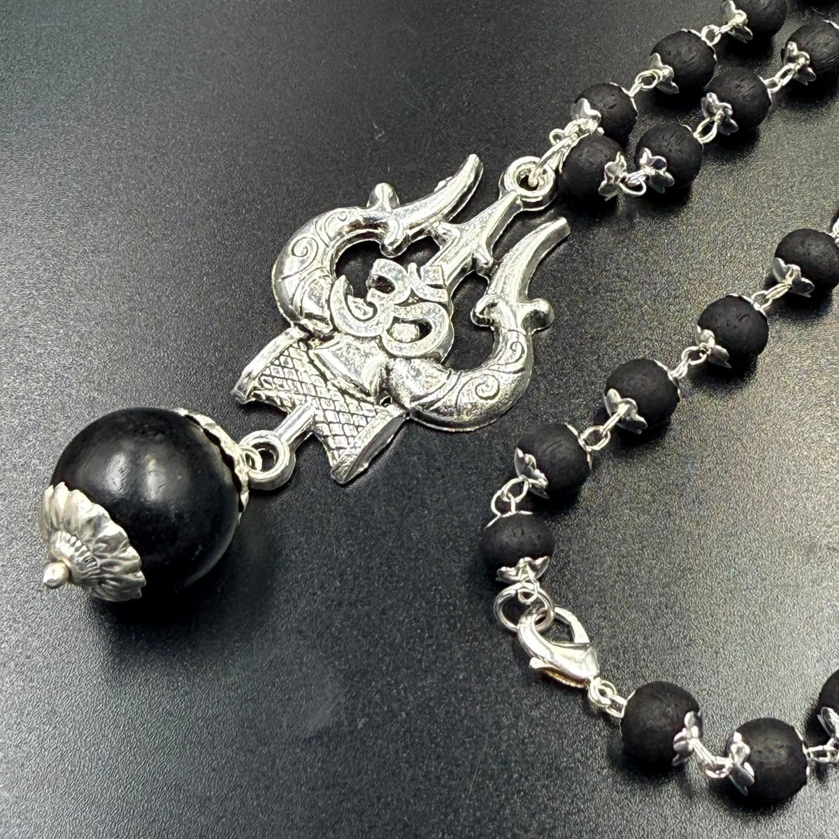 Karungali bead mala with Om Trishul metal pendant and black beads with silver chain links