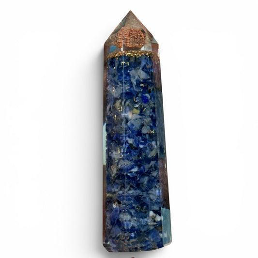 Lapis lazuli crystal tower with rudraksha cap, tall front view on plain white background