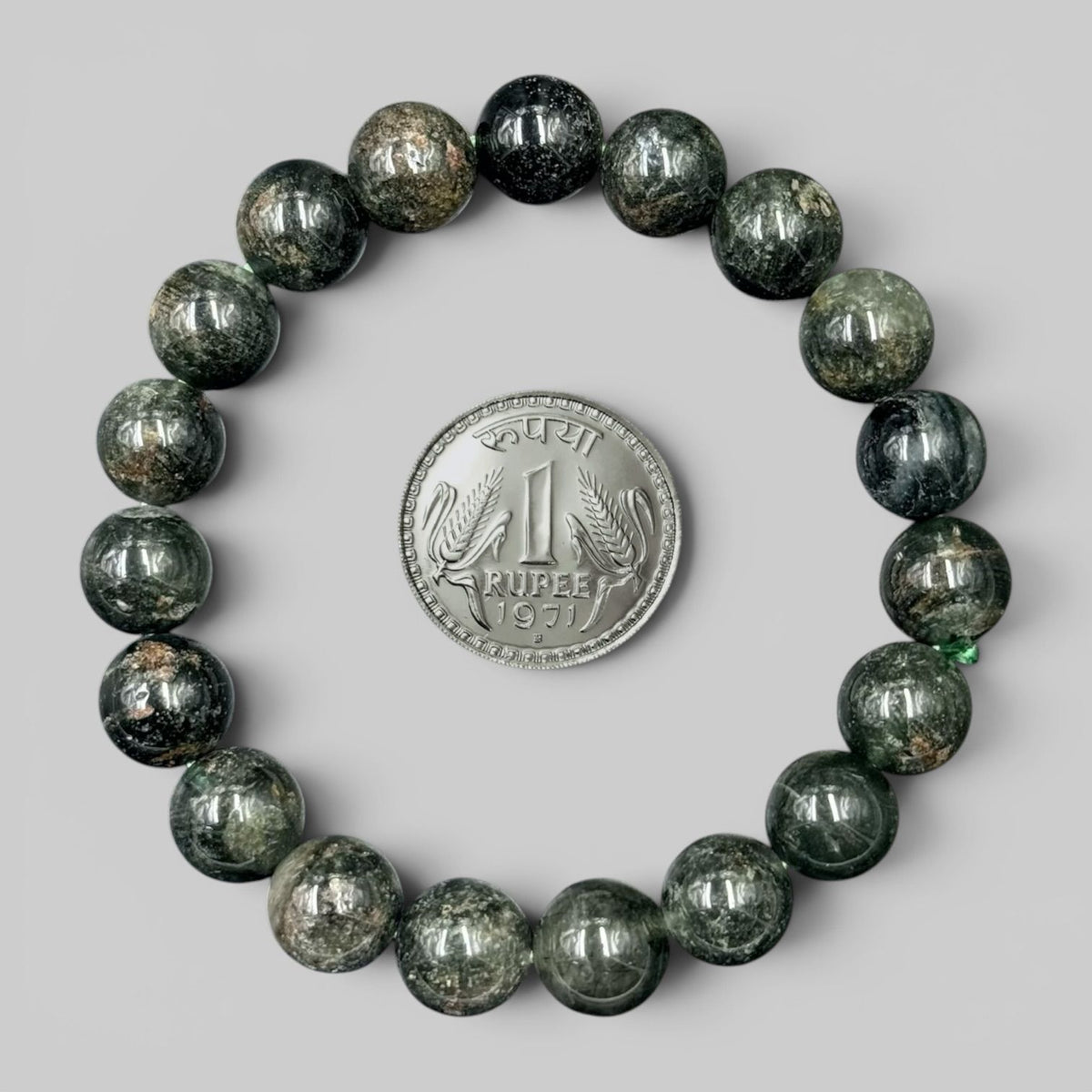 Lodolite / Garden Quartz / Phantom Quartz Bracelet with polished round beads next to Indian 1 Rupee coin