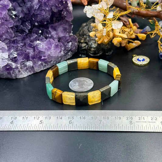 Money Magnet square bead bracelet close-up with multicolor beads and ruler measurement