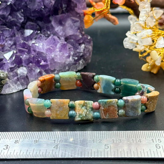 Moss agate bow-tie bead bracelet featuring rectangular gemstone beads and dark green round accents