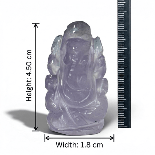 Natural amethyst Ganesh Ji carving figure with ruler for size measurement on white background
