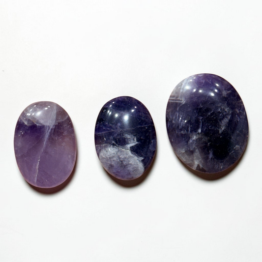 Natural amethyst palm stone, polished purple stones with glossy highlights on white