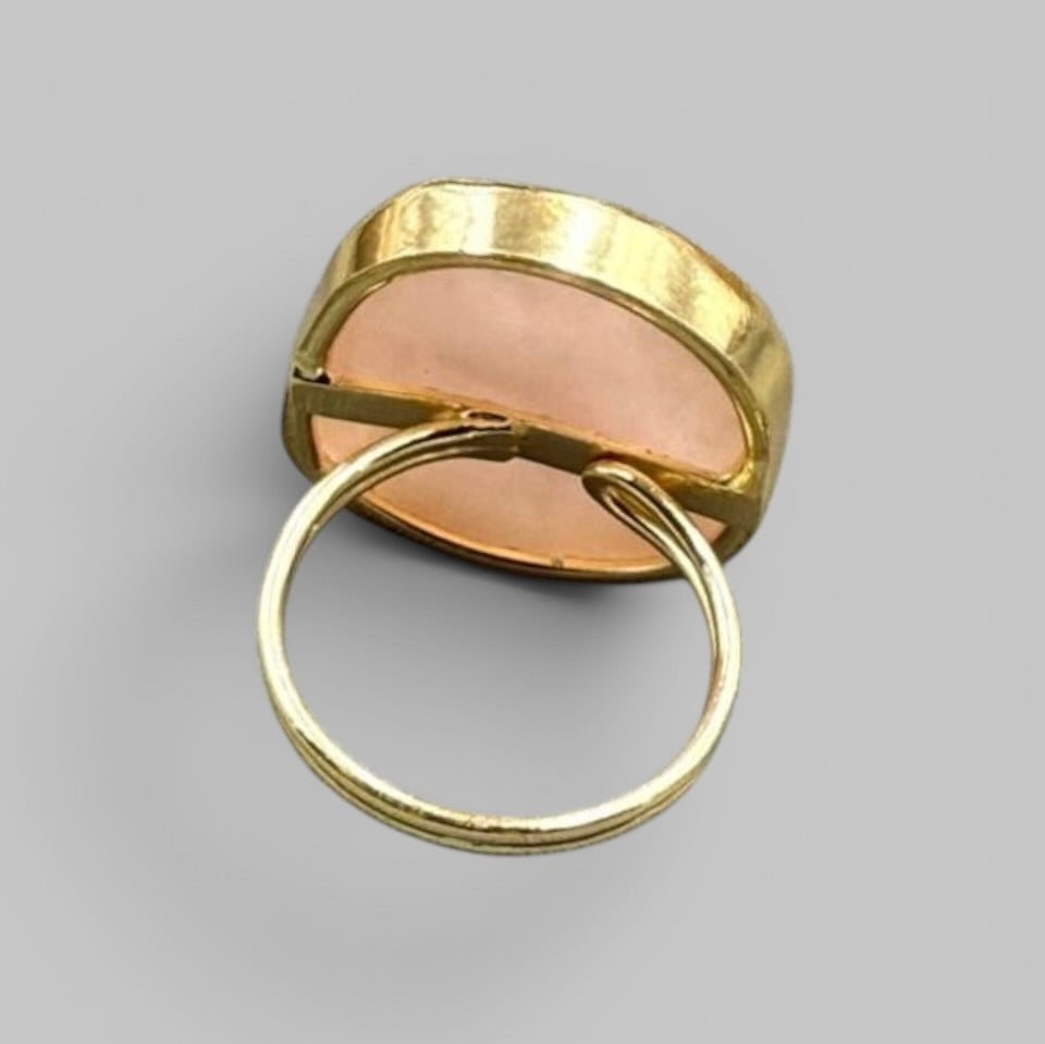 Natural rose quartz rough stone ring, gold-tone band from back showing metal details