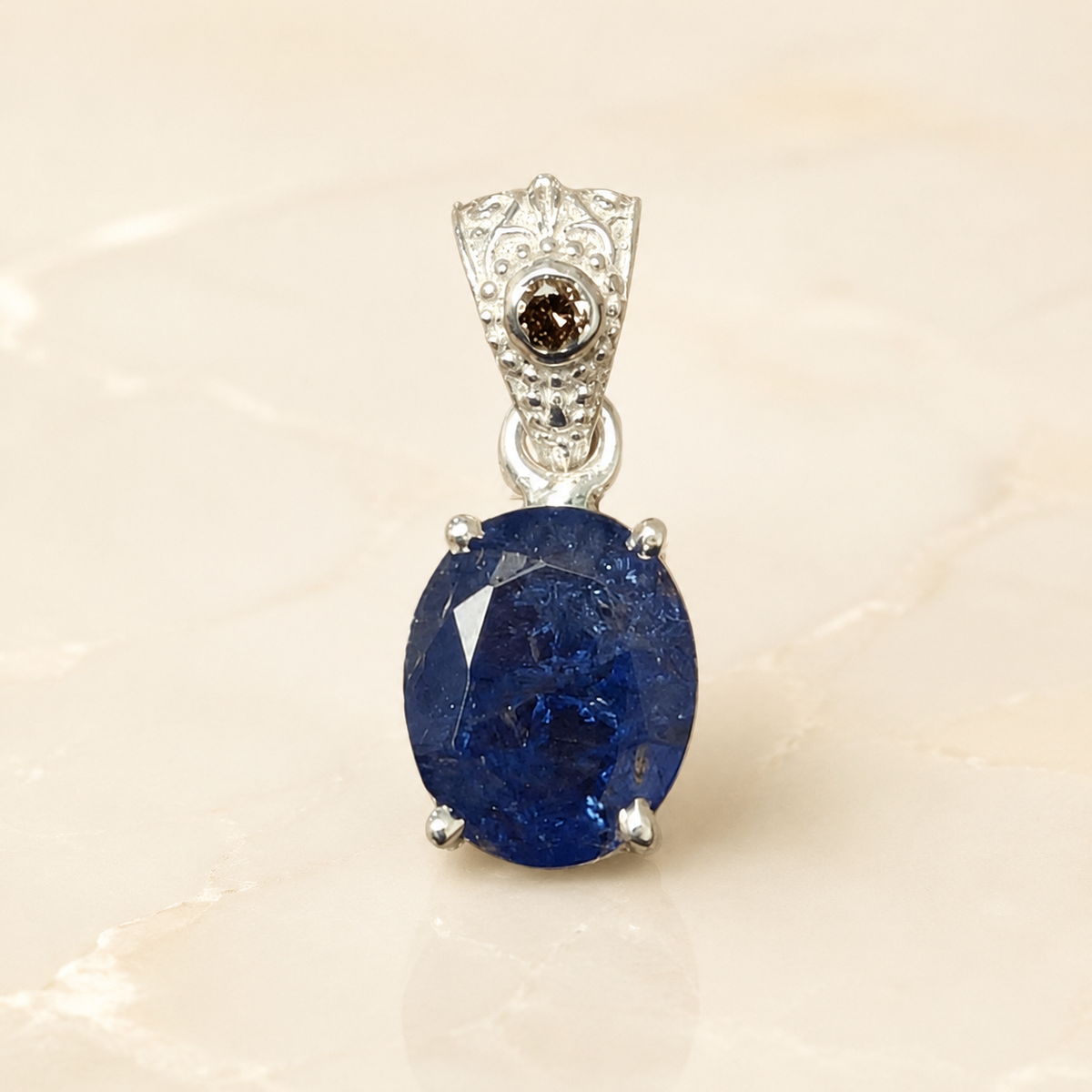 Natural tanzanite and lab-grown diamond pendant front view in 925 silver with oval gemstone