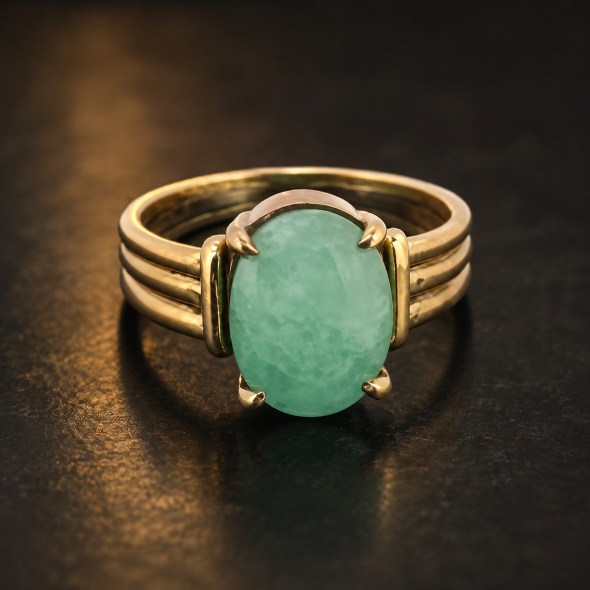 Panch dhatu emerald panna ring with oval green gemstone in gold-tone setting