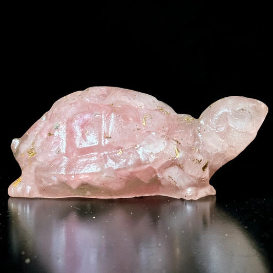 Rose quartz turtle figurine with pink gemstone body and gold-like sparkly inclusions