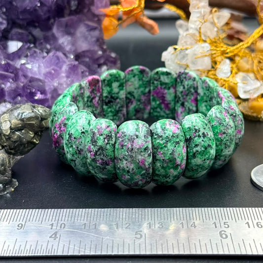 Ruby zoisite puffed cushion bead bracelet showing green beads with purple specks and ruler