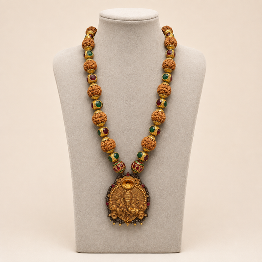 Rudraksha kundan mala necklace with Lord Ganesha pendant shown on white display bust