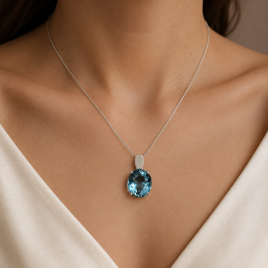 925 silver oval blue topaz locket pendant necklace worn close-up on skin