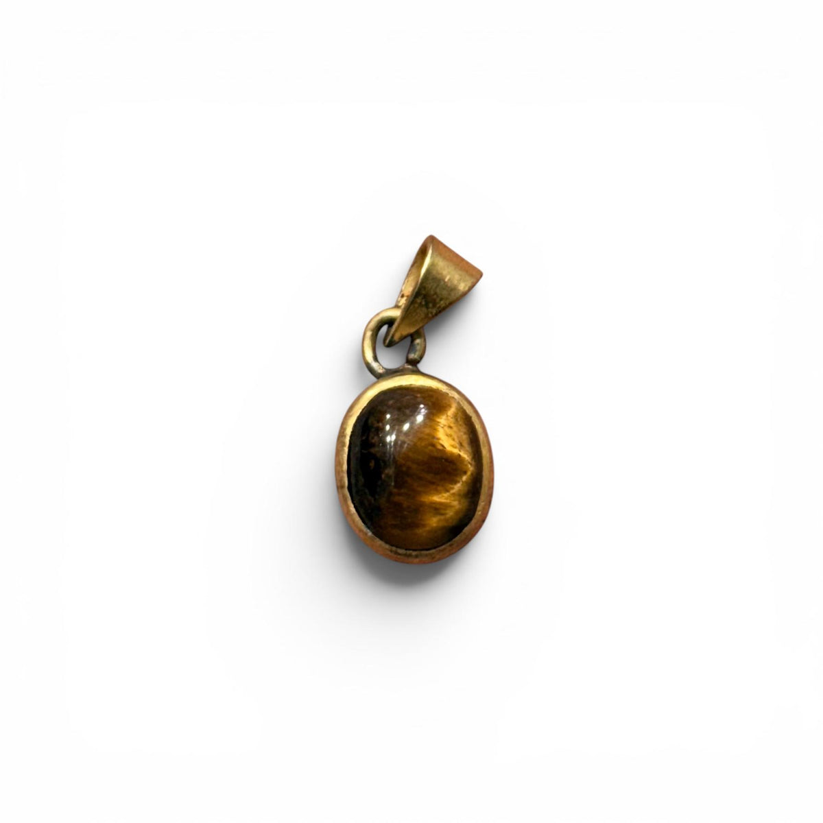 Tiger eye panchdhatu locket pendant with oval stone and gold-toned protective frame