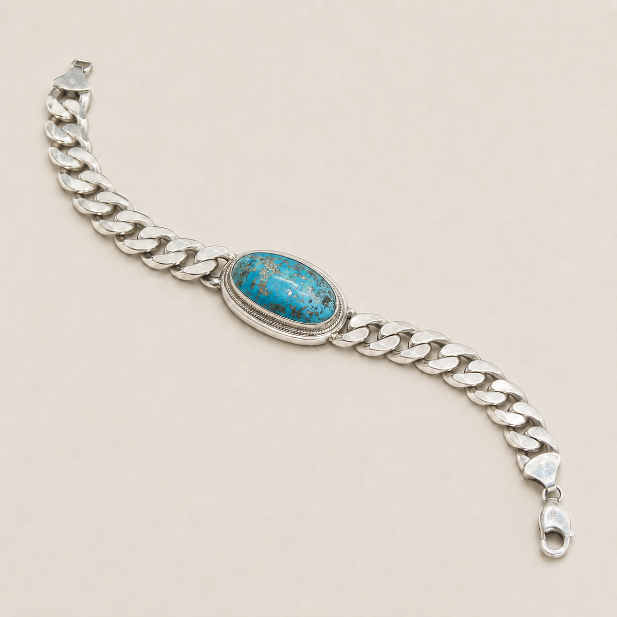 Turquoise oval centerpiece on a 925 sterling silver Cuban chain bracelet with lobster clasp
