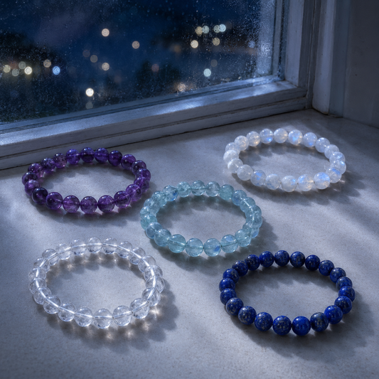 Gemstone bracelet resting in soft moonlight beside a window