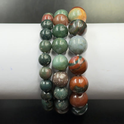 Bloodstone Bracelet with round beads in various green, brown, orange, and gray shades arranged in three strands