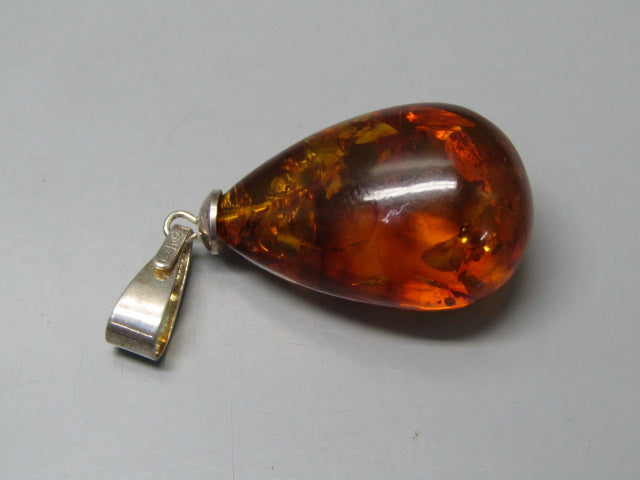 Natural Amber 27.43 Ct Amber Pendant Report No. CSQ0042905