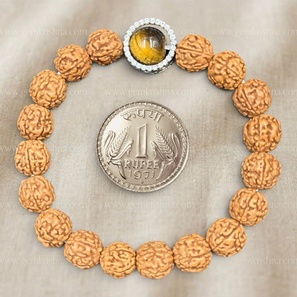 Close-up front view of 5 Mukhi rudraksh and tiger eye bracelet with metal halo
