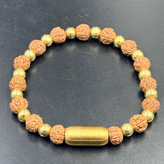 5 Mukhi rudraksha bracelet with golden beads and magnetic lock clasp on dark background