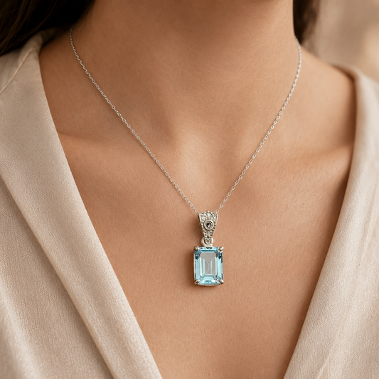 925 silver necklace pendant with emerald-cut blue topaz and lab-grown diamonds, worn on neck