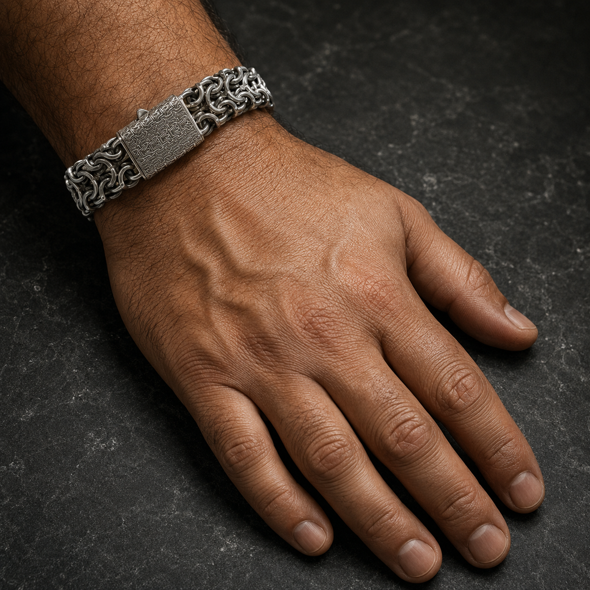 925 silver men’s Byzantine chain bracelet on hand with textured center clasp