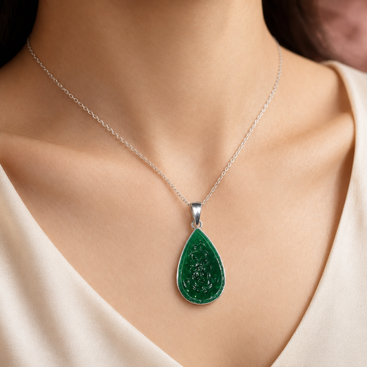 925 silver carved green onyx teardrop pendant on a chain, worn at the neckline