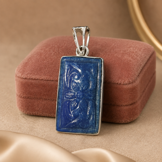 925 silver carved lapis lazuli pendant with rectangular blue stone on display pillow