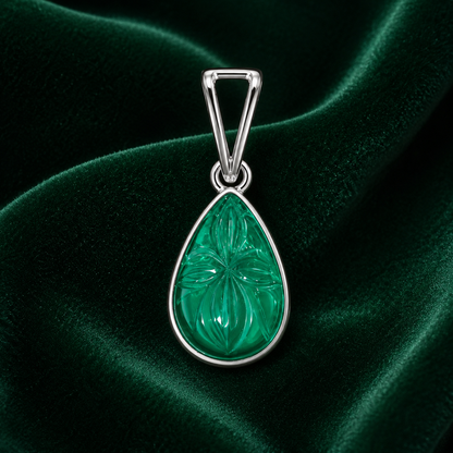 925 silver teardrop green onyx pendant with carved leaf pattern on dark green velvet