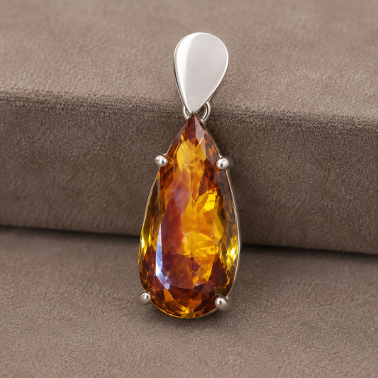 925 silver pendant with pear-shaped citrine sunela gemstone on taupe fabric
