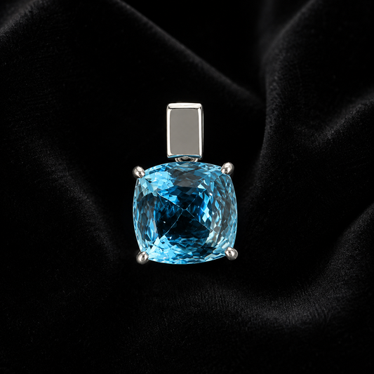 925 silver cushion-cut blue topaz pendant on black fabric background