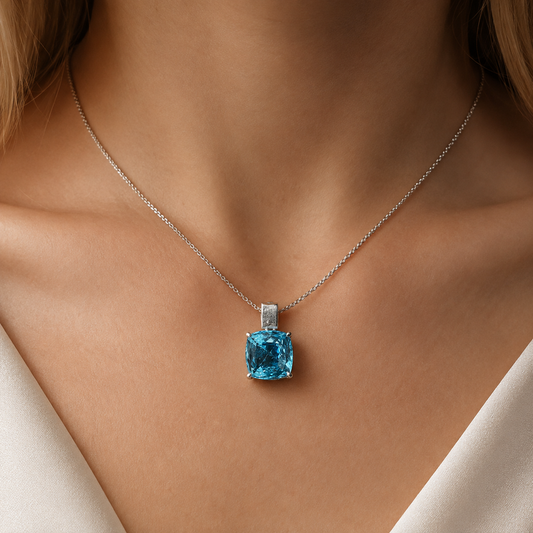 925 silver cushion-cut blue topaz pendant necklace worn close-up on chest