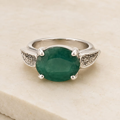 925 silver ring with large emerald green panna-cut gemstone and ornate side details