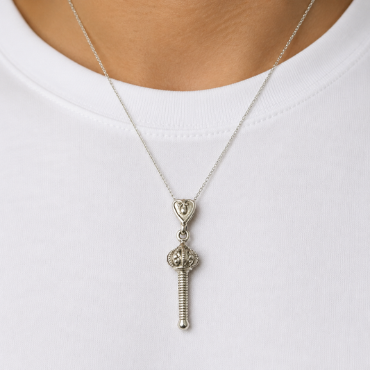925 silver Hanuman gada locket pendant worn on a silver chain against white fabric