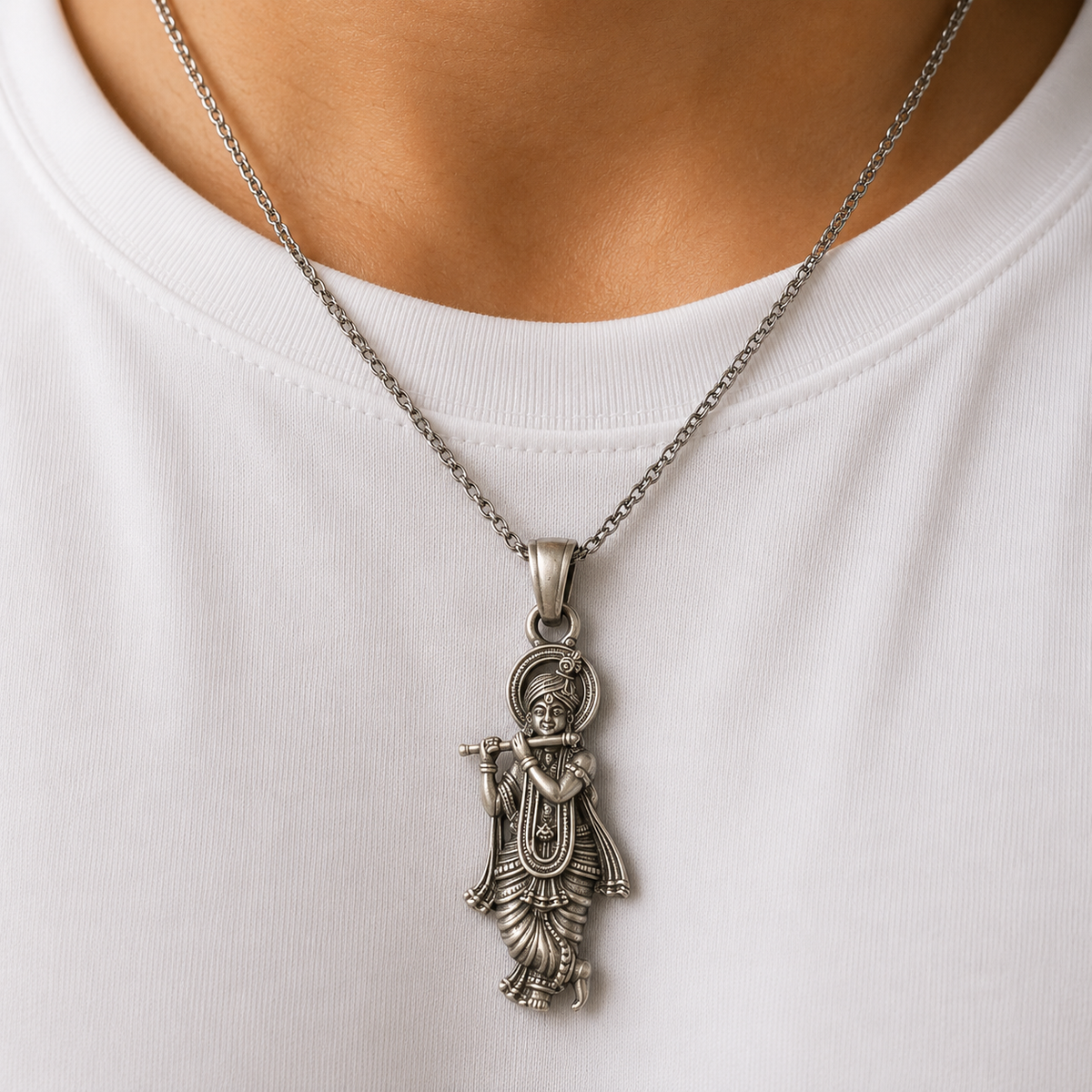 925 silver Lord Krishna murli pendant worn on a silver chain against a white shirt