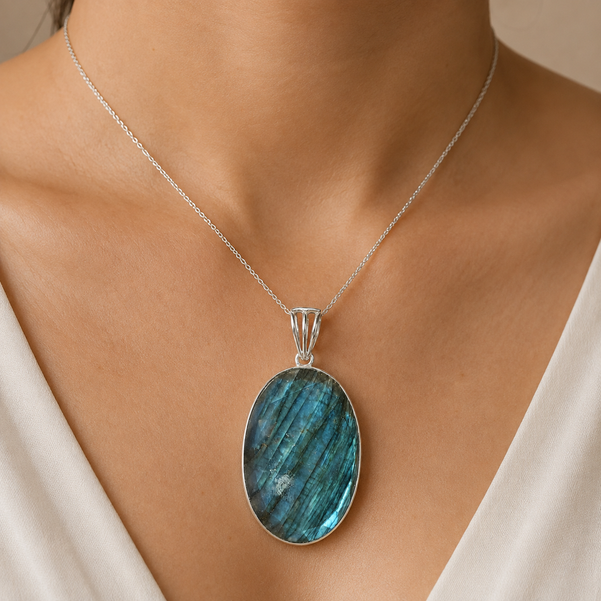925 silver labradorite locket pendant worn on a silver chain against skin and white fabric