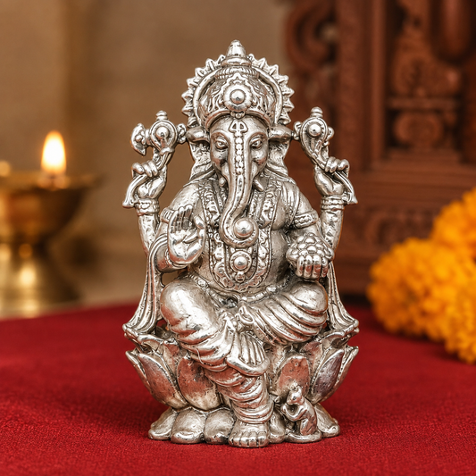 925 silver Lord Ganesha seated murti with ornate crown and four arms on red velvet