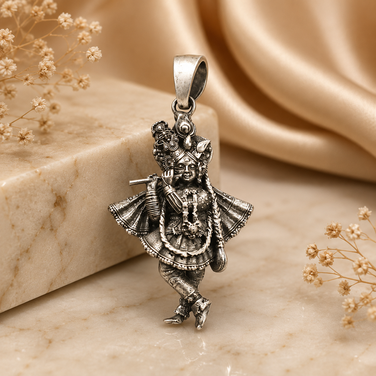 925 silver Lord Krishna flute pendant with ornate deity figure on stone background
